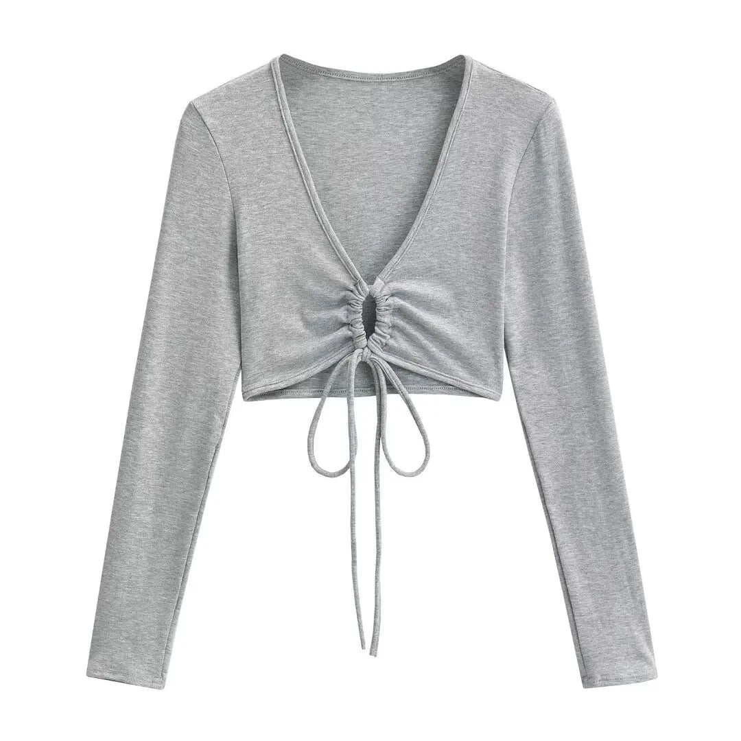 A long shirt with a circle tie in the stomach