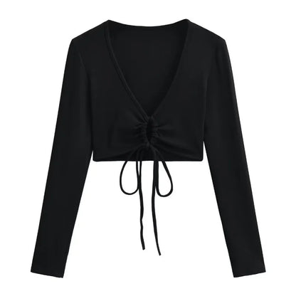 A long shirt with a circle tie in the stomach